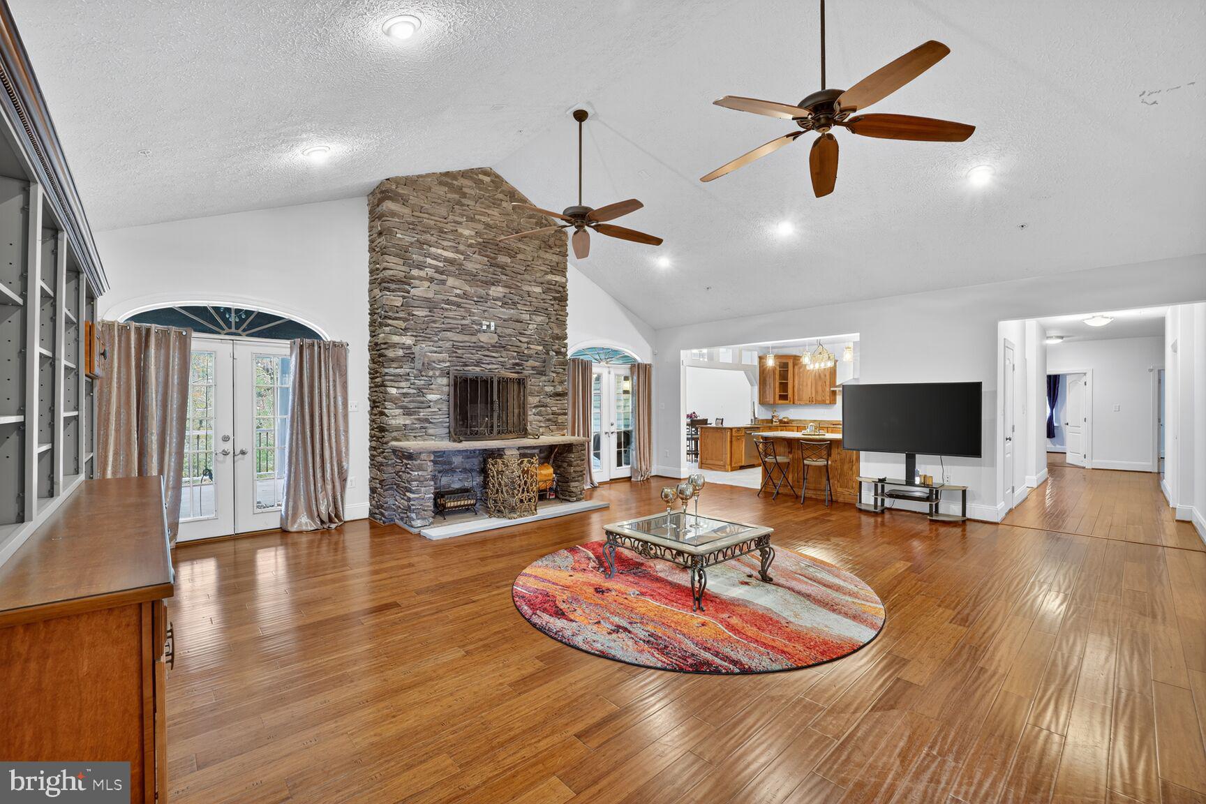 6707 Burch Hill Road Brandywine, MD 20613 - Photo 10 of 54 Beautiful Wood Floors & Stone Two-sided Fireplace