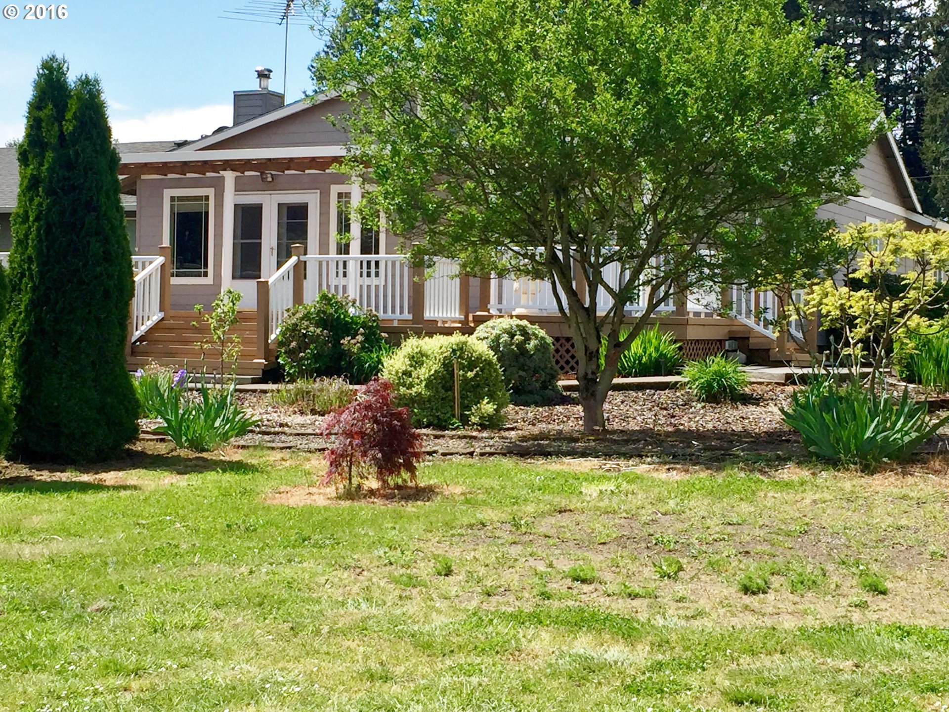 8380 Northeast Dog Ridge Road Newberg, OR 97132 - Photo 27 of 32 a front view of a house with a yard