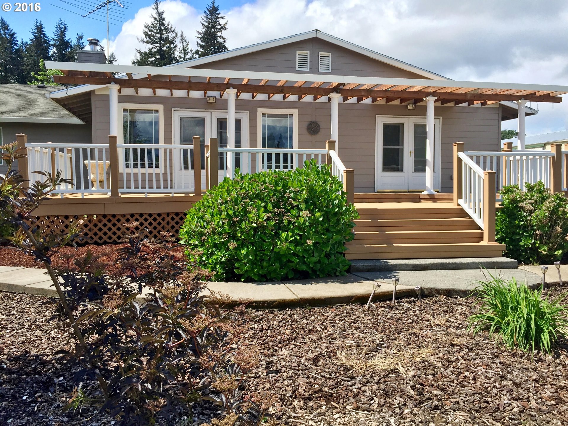 8380 Northeast Dog Ridge Road Newberg, OR 97132 - Photo 4 of 32 a front view of a house with a yard