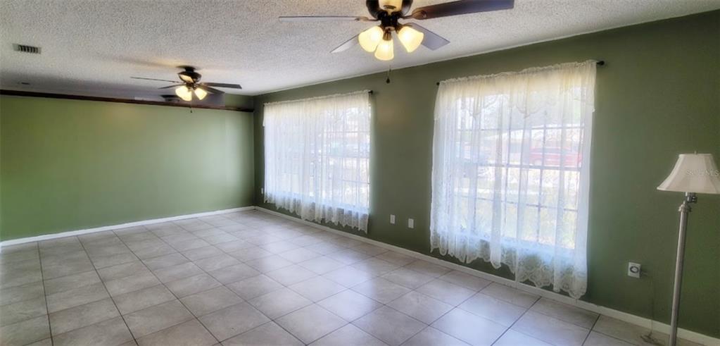406 Wright Street Inverness, FL 34452 - Photo 13 of 38 a view of an empty room with a window