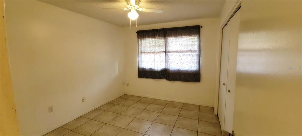 406 Wright Street Inverness, FL 34452 - Photo 16 of 38 a view of an empty room with a window