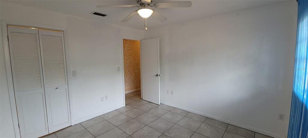 406 Wright Street Inverness, FL 34452 - Photo 20 of 38 an empty room with chandelier fan