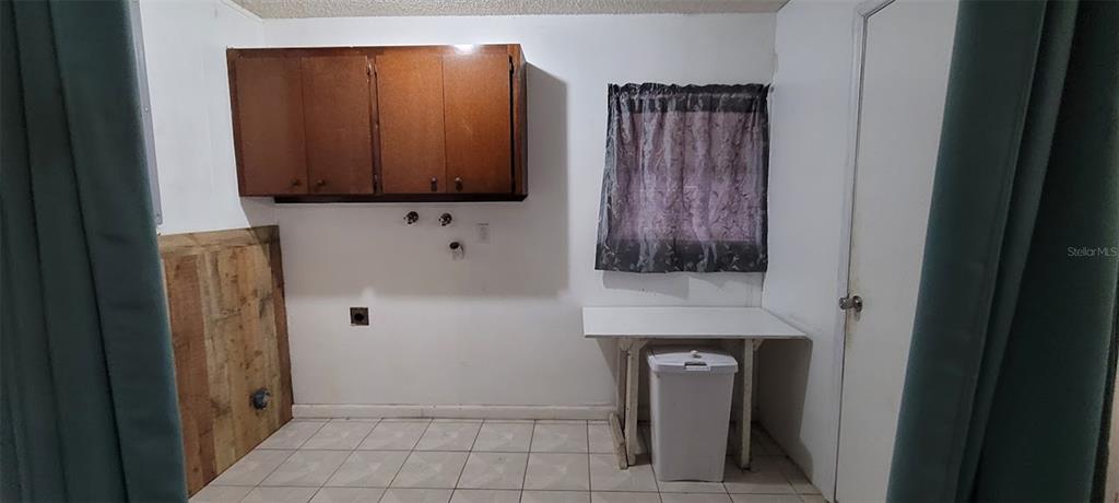 406 Wright Street Inverness, FL 34452 - Photo 30 of 38 a bathroom with a sink a mirror and shower