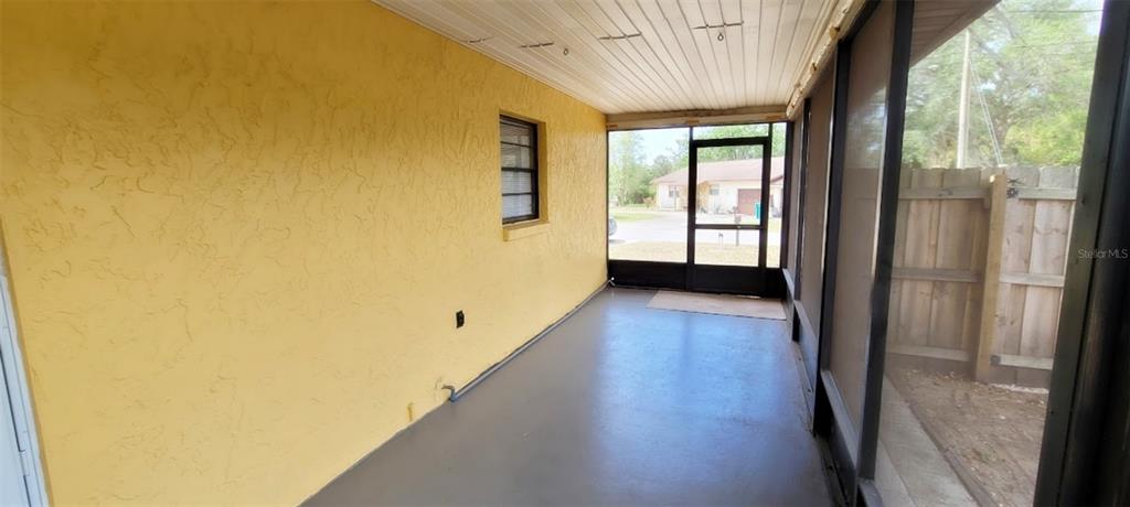 406 Wright Street Inverness, FL 34452 - Photo 32 of 38 a view of a big room with wooden floor and windows