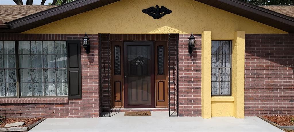 406 Wright Street Inverness, FL 34452 - Photo 5 of 38 a front view of a house with a yard