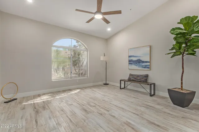 a bedroom with a bed and a table in it