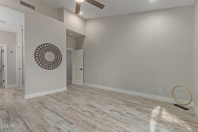 a view of a bathroom from a hallway