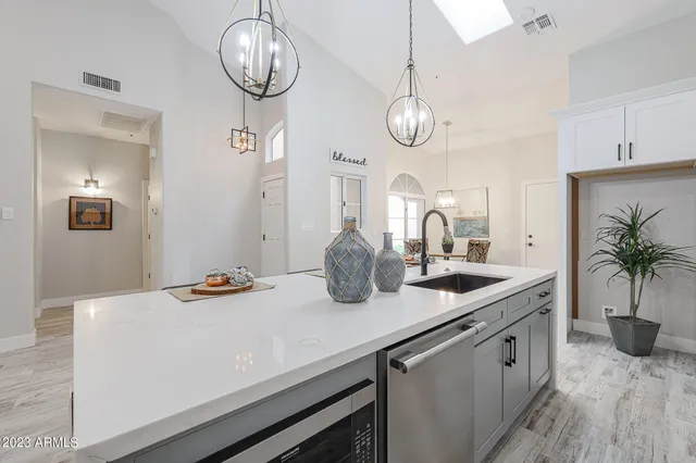 a view of a patio with a table chairs and a yard
