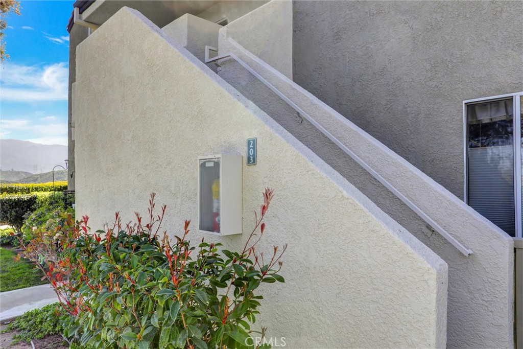 21309 Eucalyptus Way, Unit 203 Newhall, CA 91321 - Photo 13 of 20 a view of a potted plants next to a wall