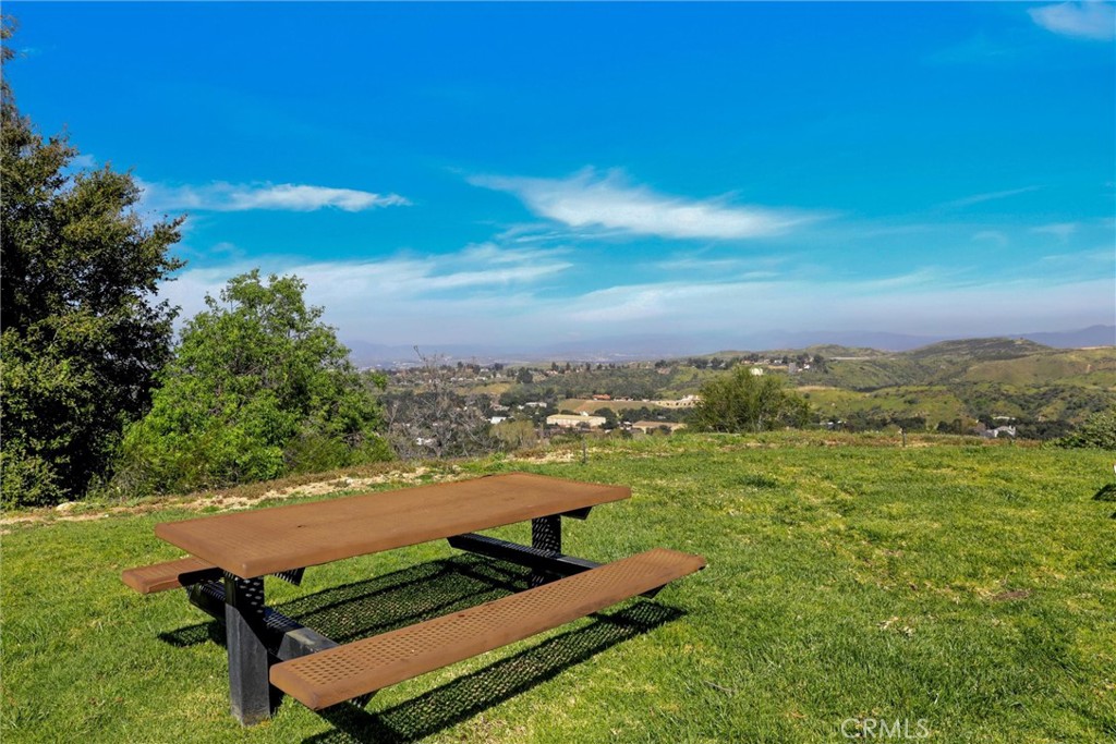 21309 Eucalyptus Way, Unit 203 Newhall, CA 91321 - Photo 16 of 20 a view of a city with lawn chairs