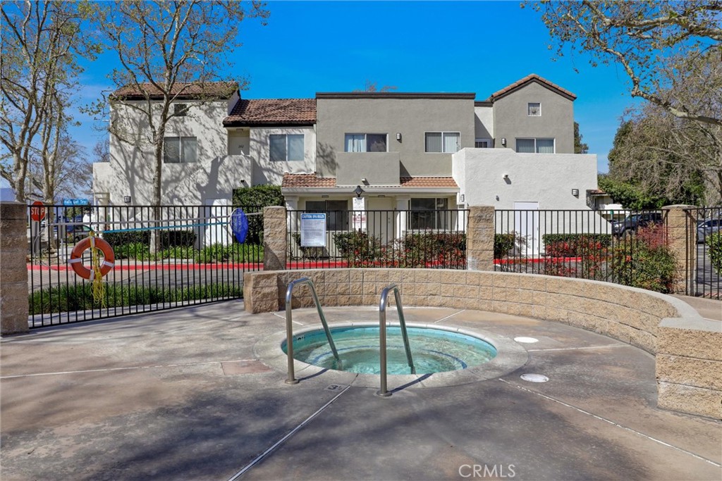 21309 Eucalyptus Way, Unit 203 Newhall, CA 91321 - Photo 19 of 20 a view of multiple houses with a patio