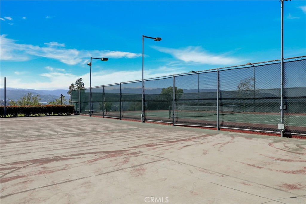 21309 Eucalyptus Way, Unit 203 Newhall, CA 91321 - Photo 20 of 20 a view of a tennis court