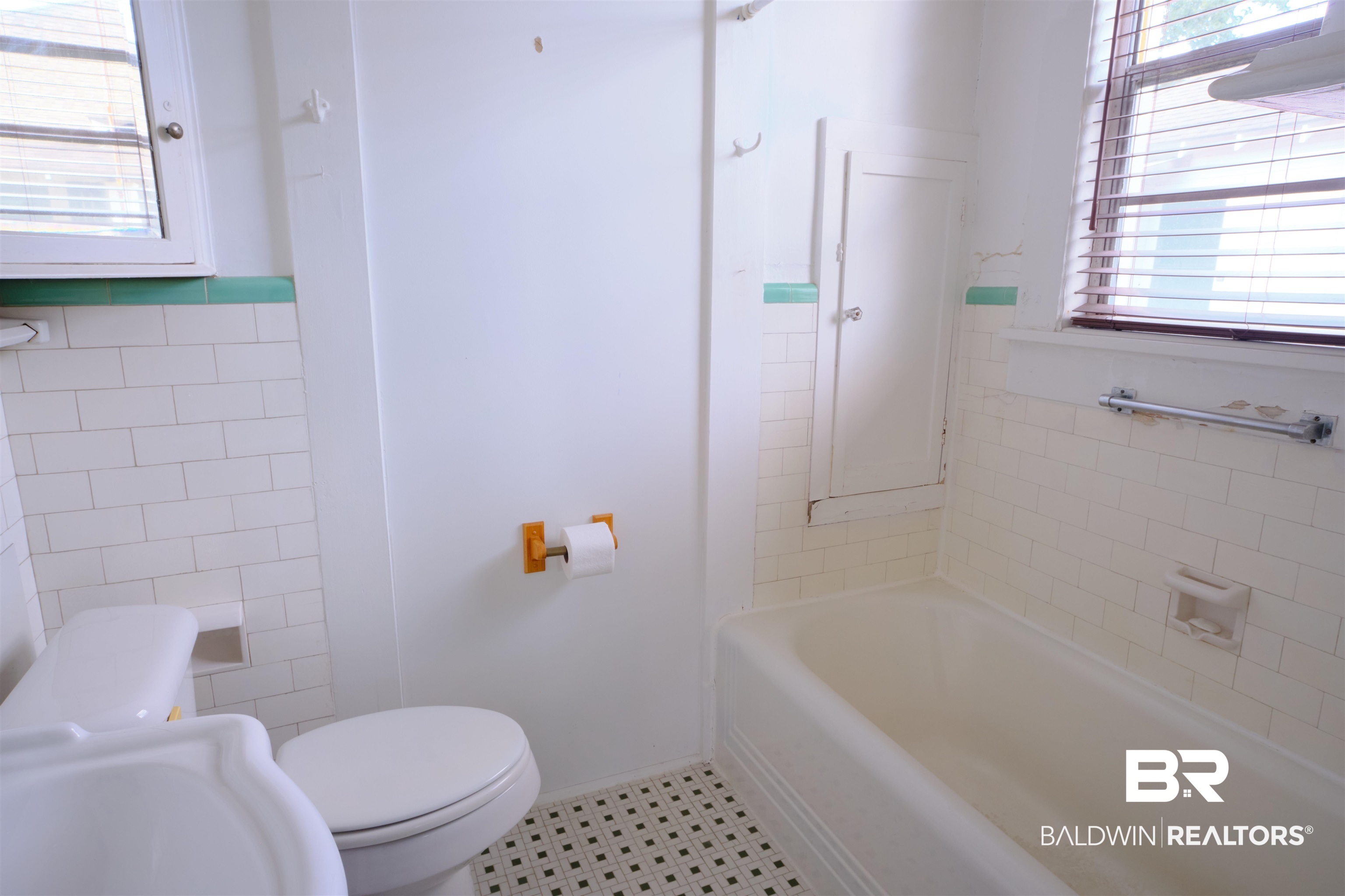 101 West Horner Street Atmore, AL 36502 - Photo 29 of 38 Bathroom featuring tile patterned flooring, toilet, and tile walls
