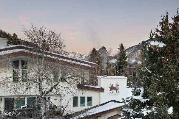 a view of a porch with furniture and front door