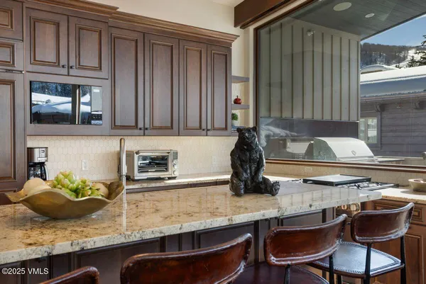 a bedroom with a large bed and a flat screen tv