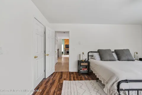 a bedroom with a bed and a table