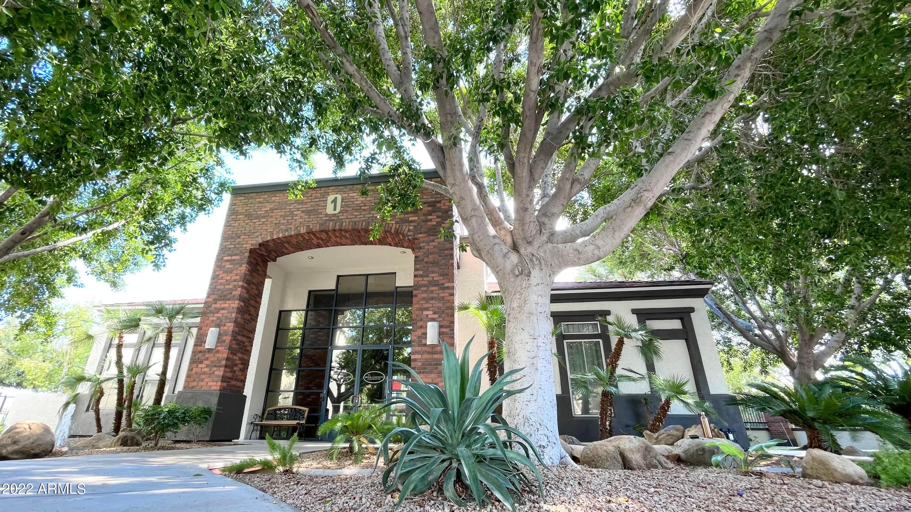 3302 North 7th Street, Unit 222 Phoenix, AZ 85014 - Photo 1 of 30 a front view of a house with garden