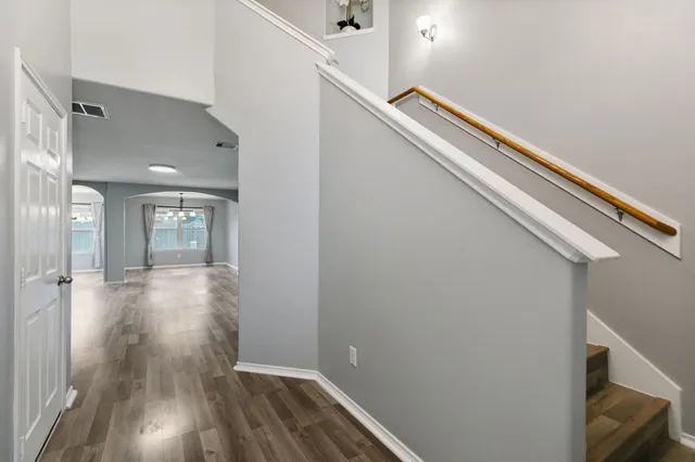 a view of gallery with wooden floor