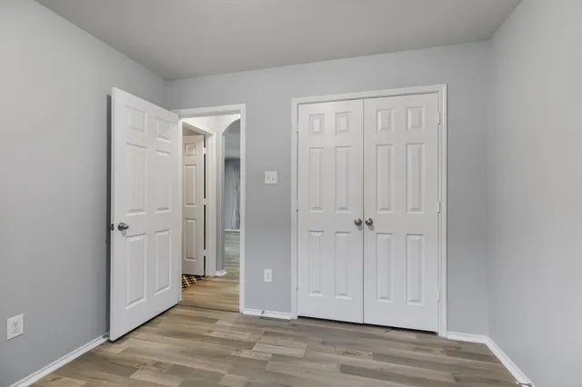 a view of a livingroom with wooden floor