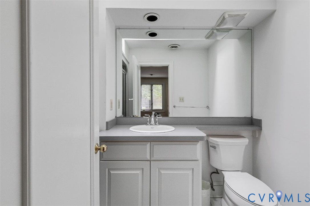 3820 Reeds Landing Circle Midlothian, VA 23113 - Photo 13 of 25 a bathroom with a sink vanity mirror and toilet