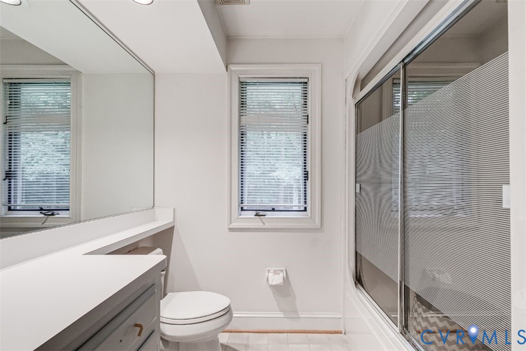 3820 Reeds Landing Circle Midlothian, VA 23113 - Photo 16 of 25 a bathroom with a toilet a sink and a shower