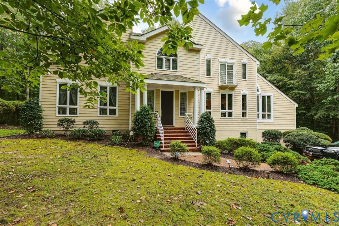 3820 Reeds Landing Circle Midlothian, VA 23113 - Photo 2 of 25 a front view of a house with a yard