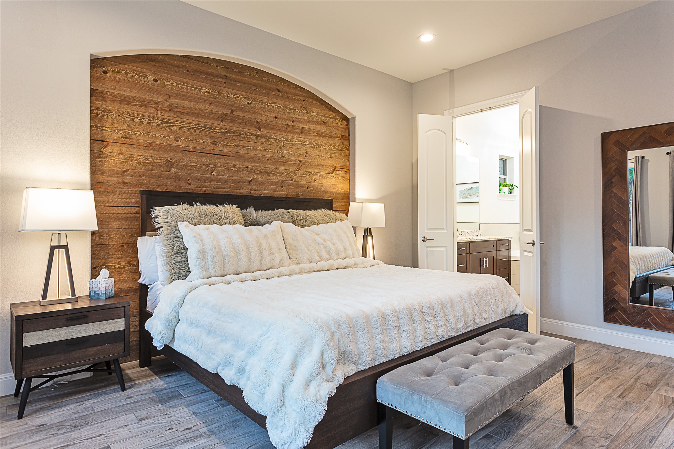 5608 Arroyo Road Austin, TX 78734 - Photo 21 of 39 Bedroom featuring light wood-style flooring, connected bathroom, and recessed lighting