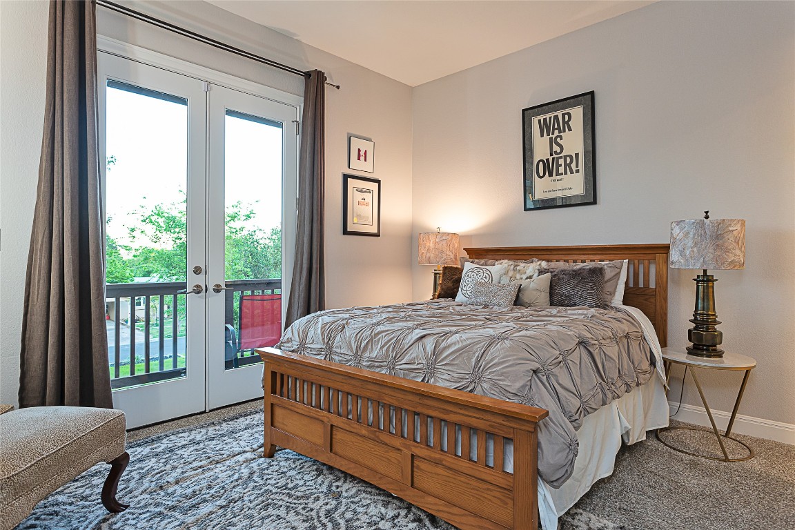 5608 Arroyo Road Austin, TX 78734 - Photo 27 of 39 Bedroom featuring french doors, access to exterior, and carpet flooring