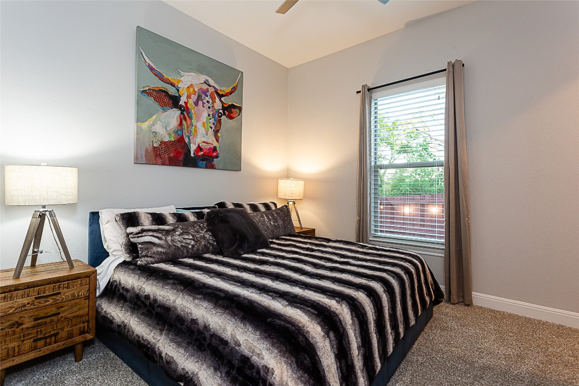 5608 Arroyo Road Austin, TX 78734 - Photo 30 of 39 Carpeted bedroom with ceiling fan and baseboards