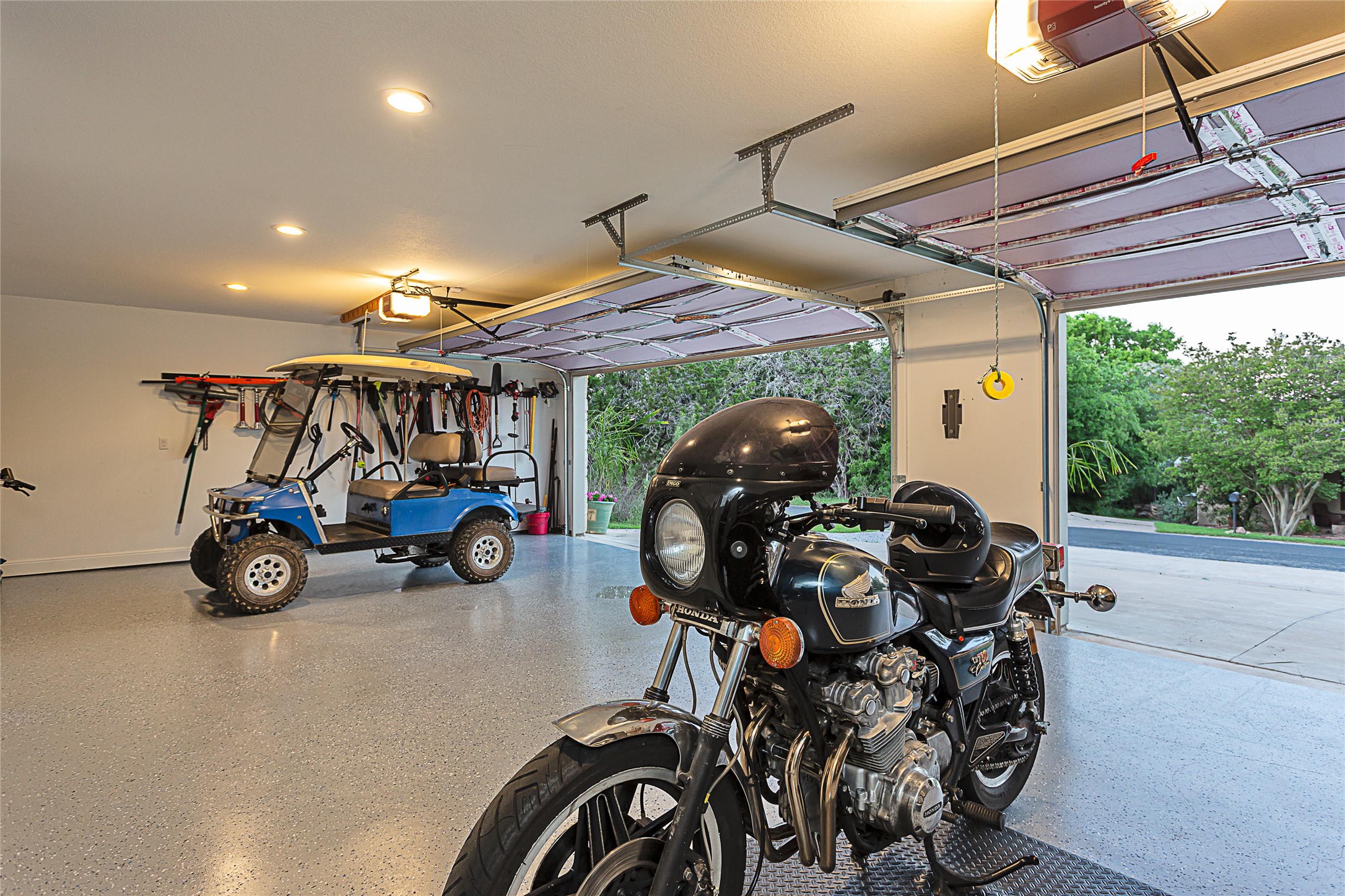 5608 Arroyo Road Austin, TX 78734 - Photo 33 of 39 Garage featuring a garage door opener