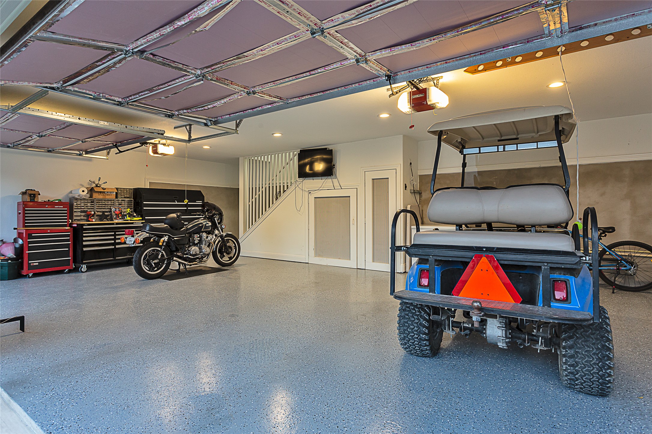 5608 Arroyo Road Austin, TX 78734 - Photo 34 of 39 Garage with a garage door opener and recessed lighting