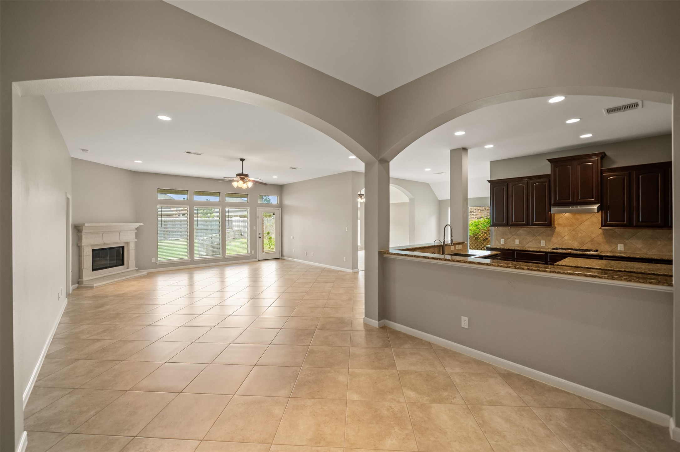 2818 Red Maple Drive Katy, TX 77494 - Photo 19 of 50 a large kitchen with granite countertop a large counter top stainless steel appliances and cabinets
