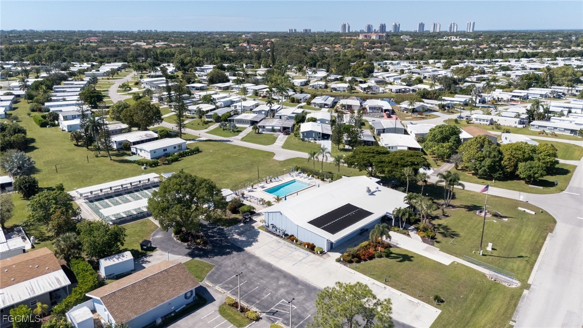 9324 Baron Road Bonita Springs, FL 34135 - Photo 20 of 22 an aerial view of a house with a swimming pool lake and mountain view