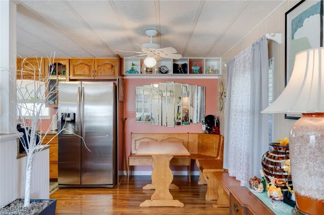 a kitchen with stainless steel appliances granite countertop a refrigerator and a stove