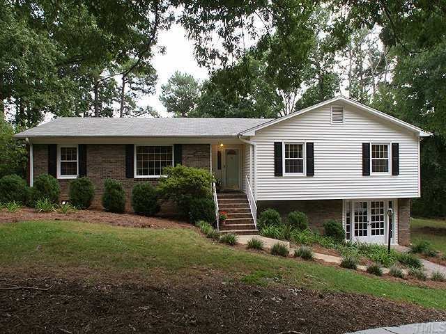 Welcome Home!  From the front circular drive you will be welcomed by wide brick steps and covered entrance.  You can also access the lower level through these lovely french doors.  Great home office or In-Law Suite