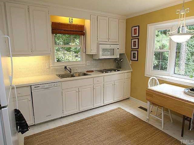 Cooks delight!  This light filled kitchen is just waiting for you to personalize with your favorite colors and cook books! All appliances convey!  Kitchen-Aid appliances and built in cook top.