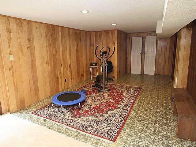 2649 Umstead Road Durham, NC 27712 - Photo 8 of 12 Spacious, light filled lower level to use as a 4th bedroom with a full bath. May even want to use it as your home office or an in-law suite. Great area for game room and exercise room. There is also a large fireplace.