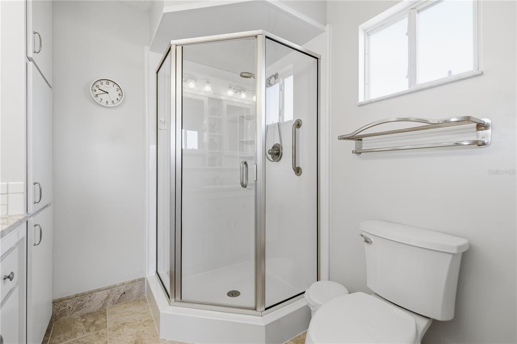 10492 Southeast 178th Street Summerfield, FL 34491 - Photo 17 of 32 a bathroom with a shower a toilet and a sink