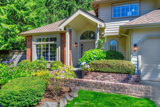 a front view of a house with garden