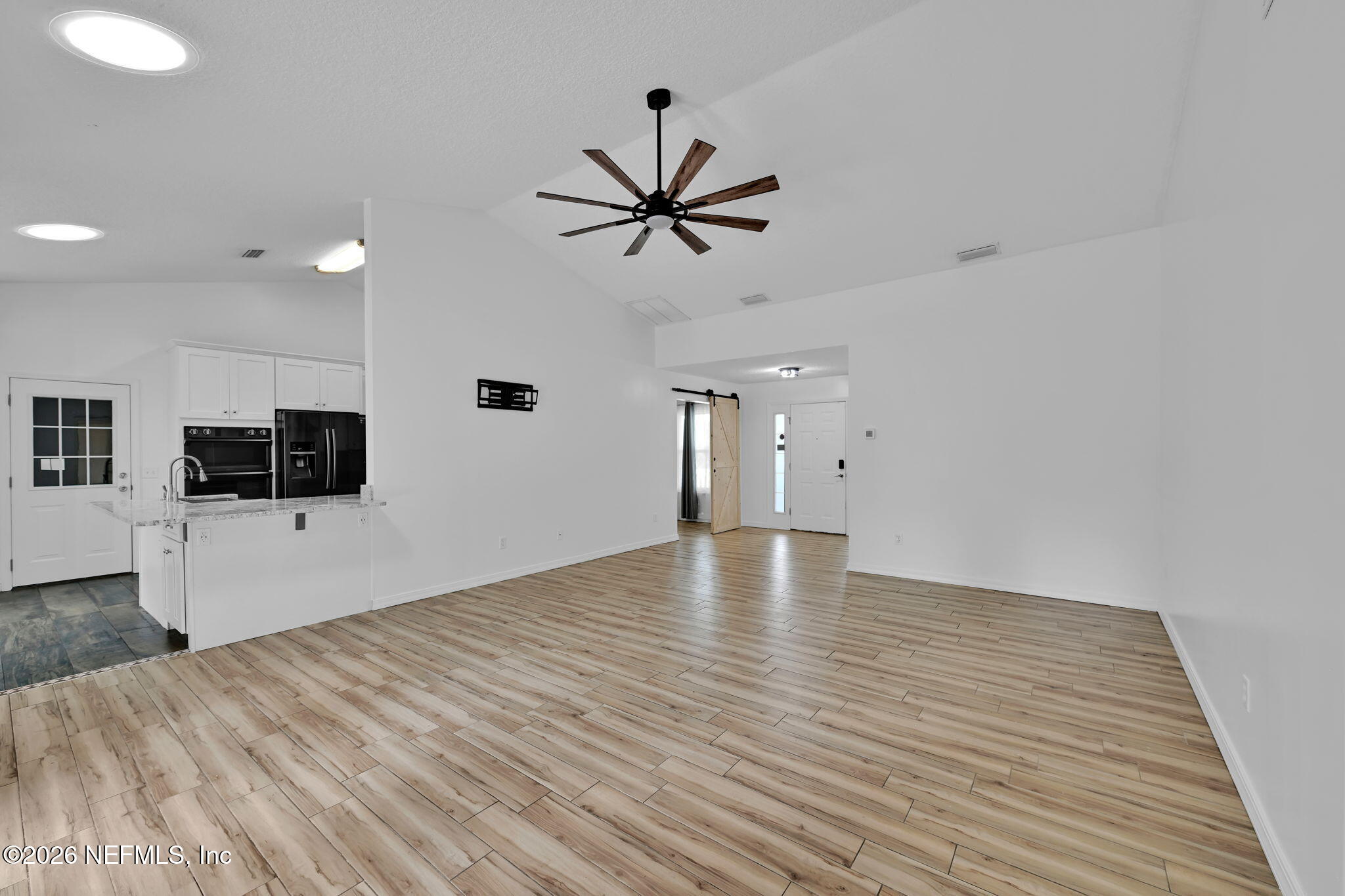 1110 Woodlawn Road, Unit D St. Augustine, FL 32084 - Photo 20 of 40 a view of a livingroom with a flat screen tv