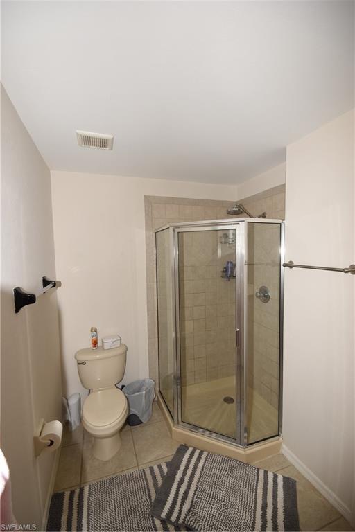 11738 Eros Road Lehigh Acres, FL 33971 - Photo 16 of 42 a bathroom with a toilet and a shower