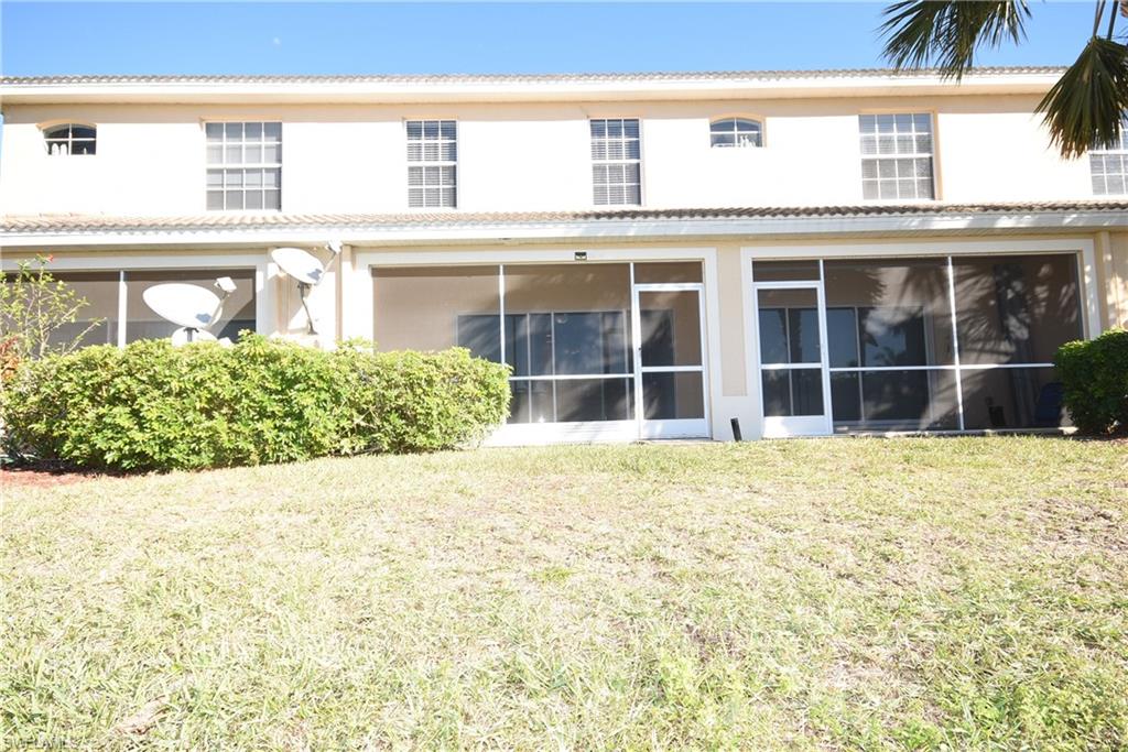 11738 Eros Road Lehigh Acres, FL 33971 - Photo 25 of 42 front view of a brick house