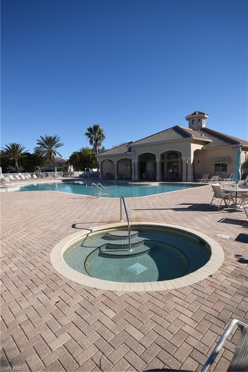11738 Eros Road Lehigh Acres, FL 33971 - Photo 32 of 42 a view of outdoor space with swimming pool and seating