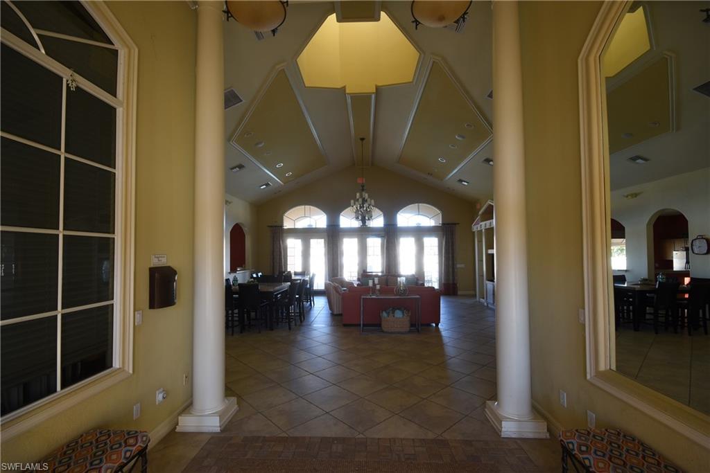 11738 Eros Road Lehigh Acres, FL 33971 - Photo 35 of 42 a view of entryway and hall with dining room