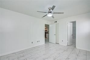 17331 Red Oak Drive, Unit 45 Houston, TX 77090 - Photo 13 of 25 an empty room with closet and a chandelier fan