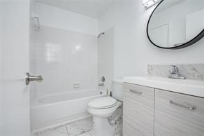 17331 Red Oak Drive, Unit 45 Houston, TX 77090 - Photo 20 of 25 a bathroom with a toilet sink vanity tub and mirror