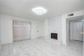 17331 Red Oak Drive, Unit 45 Houston, TX 77090 - Photo 23 of 25 a view of a livingroom with a fireplace
