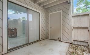 17331 Red Oak Drive, Unit 45 Houston, TX 77090 - Photo 24 of 25 a view of a bathroom with a glass door