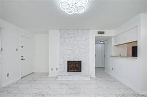 17331 Red Oak Drive, Unit 45 Houston, TX 77090 - Photo 3 of 25 a view of an empty room with a fireplace and a window