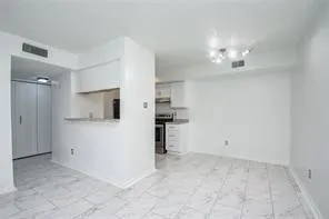 a view of a kitchen with a sink stove and a refrigerator